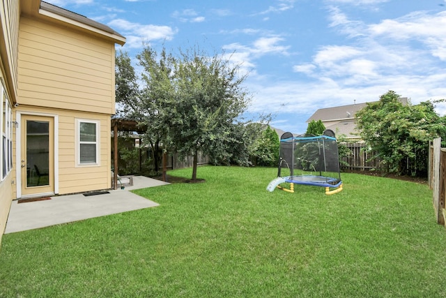 view of yard featuring a patio area and a trampoline