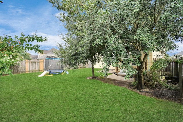 view of yard featuring a trampoline