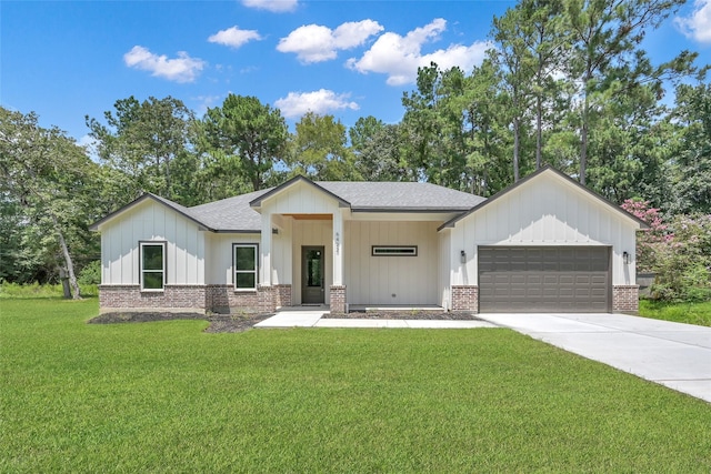 modern farmhouse style home with a garage and a front lawn