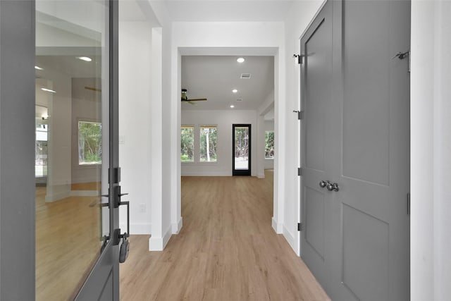 hall with light hardwood / wood-style flooring