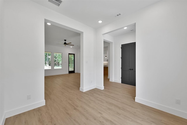 unfurnished room featuring ceiling fan and light wood-type flooring