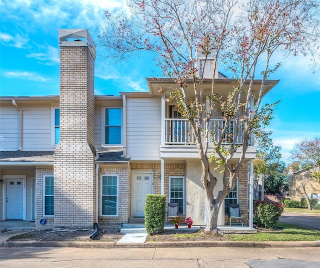 view of front of property with a balcony