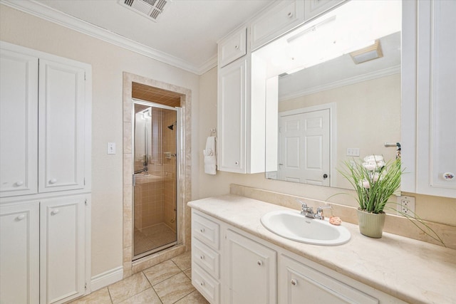 bathroom featuring tile patterned flooring, crown molding, a shower with shower door, and vanity