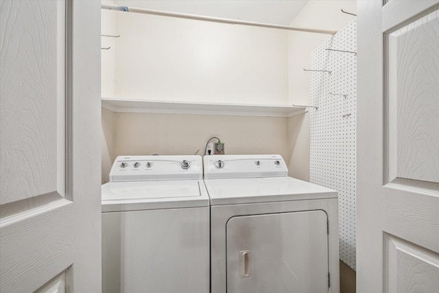 laundry room featuring washing machine and dryer