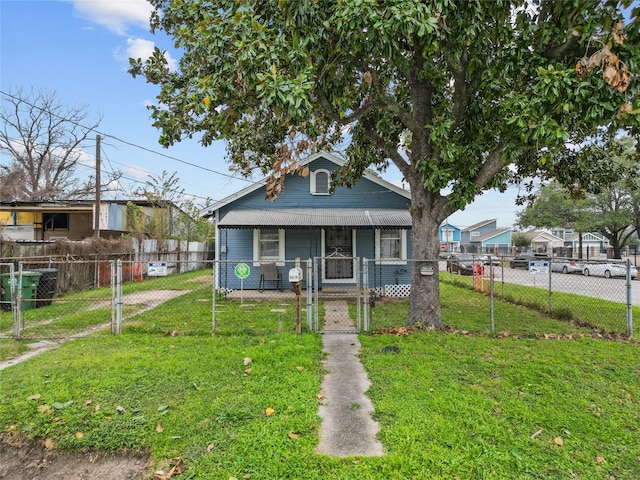 bungalow-style home featuring a front lawn