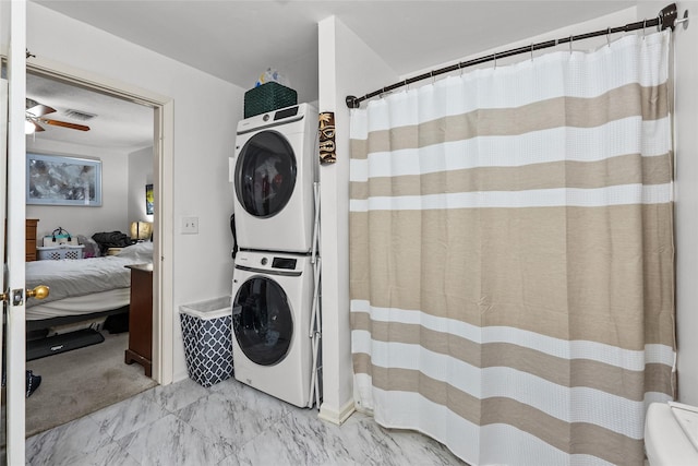 laundry room featuring stacked washing maching and dryer