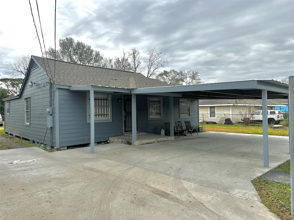 view of front of home with a carport