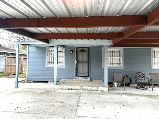 entrance to property featuring a porch