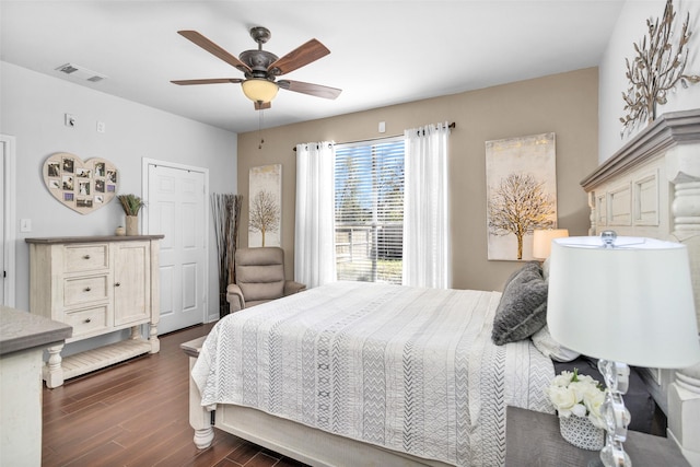 bedroom featuring ceiling fan and dark wood-type flooring