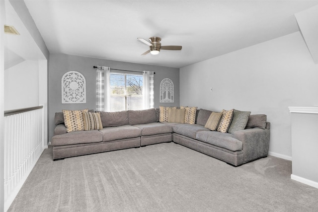 carpeted living room featuring ceiling fan