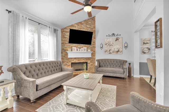 living room featuring lofted ceiling, a fireplace, and ceiling fan