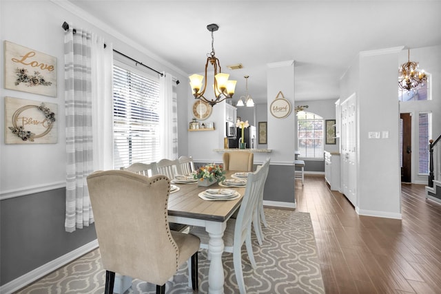 dining area featuring crown molding and dark wood-type flooring