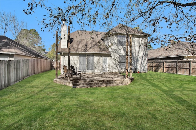 rear view of property with a patio area and a yard