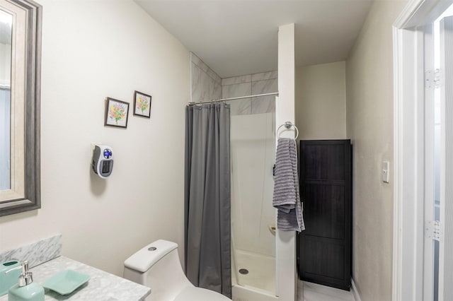 bathroom with toilet, walk in shower, and vanity