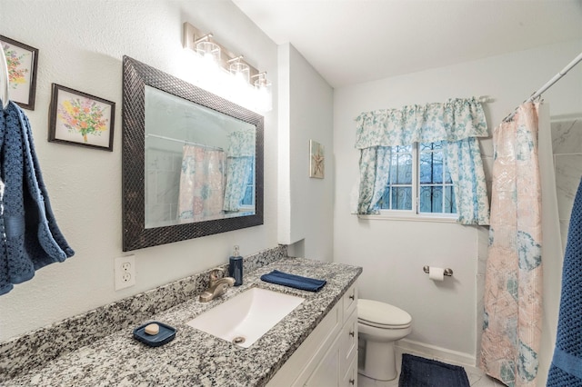 bathroom with curtained shower, vanity, and toilet