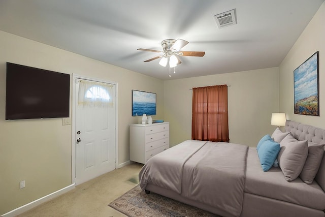 bedroom featuring light carpet and ceiling fan