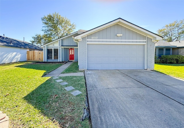 ranch-style home featuring a garage and a front yard