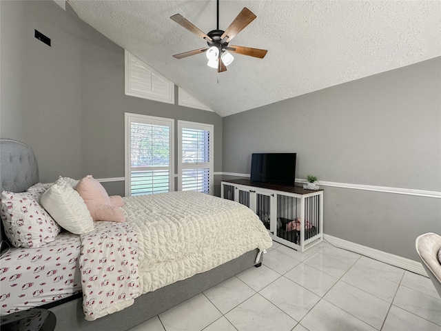 tiled bedroom with high vaulted ceiling, a textured ceiling, and ceiling fan