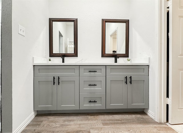 bathroom featuring hardwood / wood-style floors and vanity