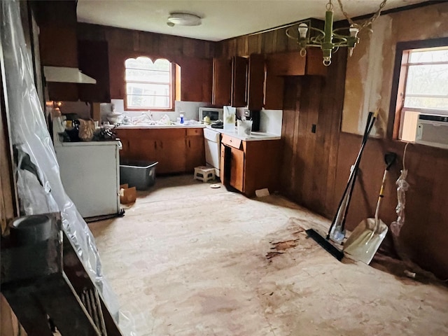 kitchen with sink and wood walls