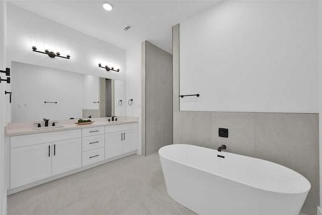 bathroom featuring a bath and vanity