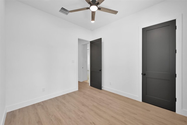 unfurnished bedroom with ceiling fan and light hardwood / wood-style flooring