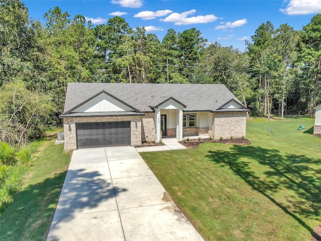 ranch-style home featuring a front lawn and a garage