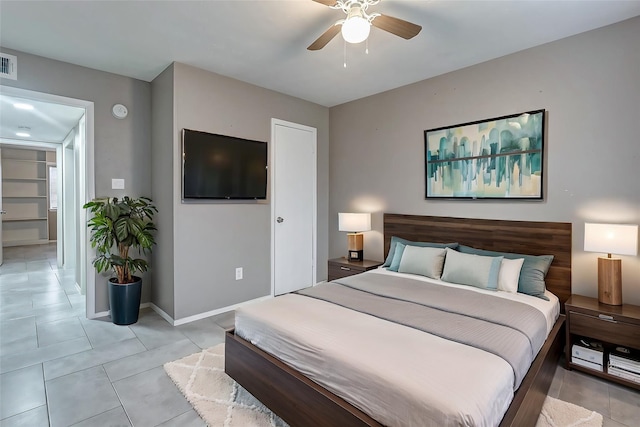 bedroom featuring light tile patterned flooring and ceiling fan