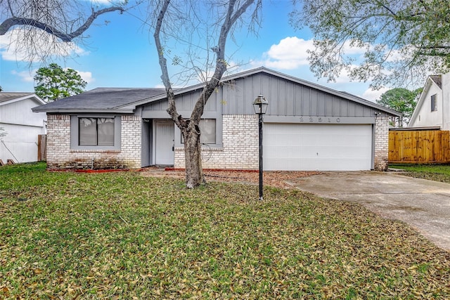 ranch-style house featuring a front lawn and a garage