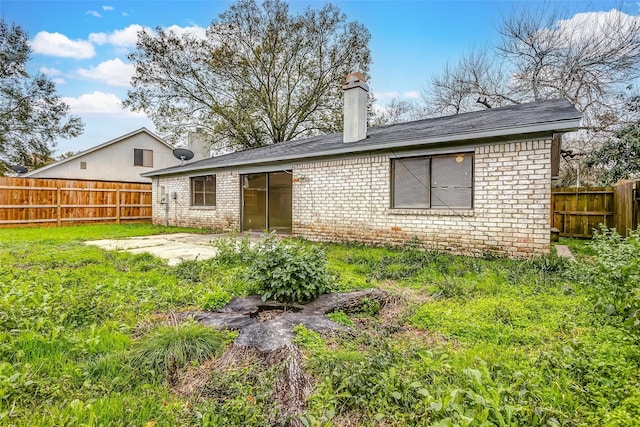 rear view of house with a patio