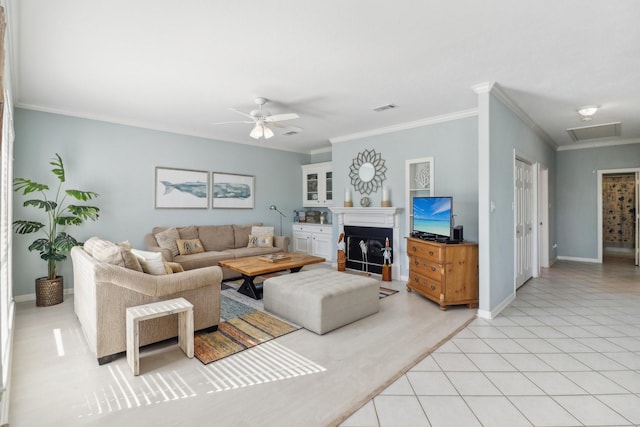 living room featuring ceiling fan, crown molding, and light tile patterned floors