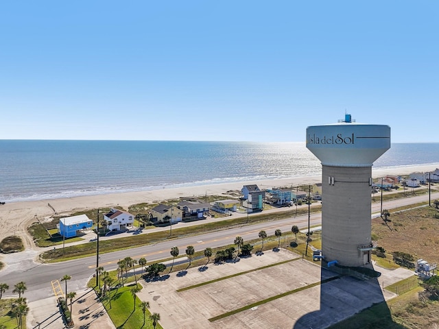 aerial view with a water view and a view of the beach