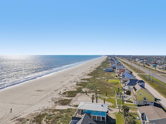 bird's eye view featuring a view of the beach and a water view