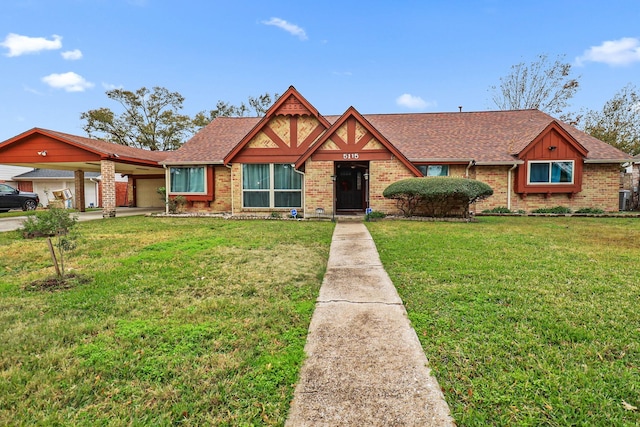 view of front of property with a front yard and a carport