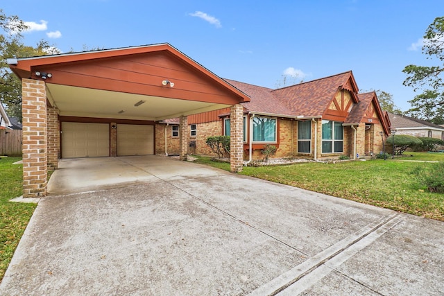 view of front of home featuring a front yard, a carport, and a garage