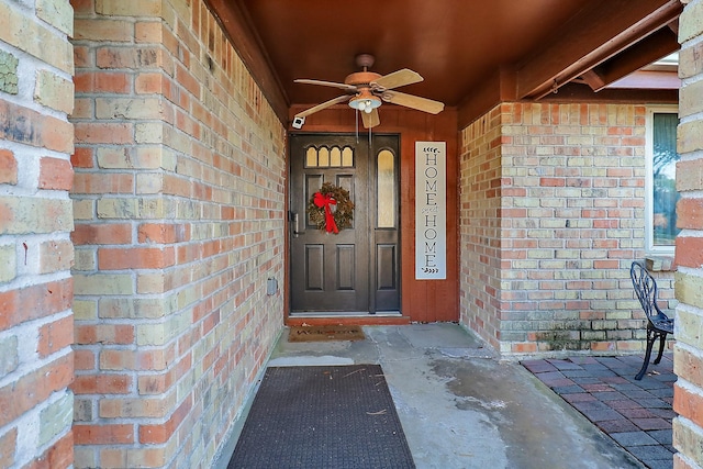 doorway to property featuring ceiling fan