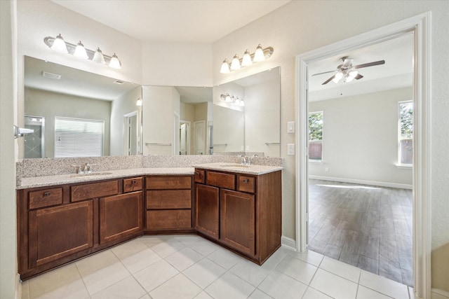 bathroom with ceiling fan, vanity, and tile patterned floors