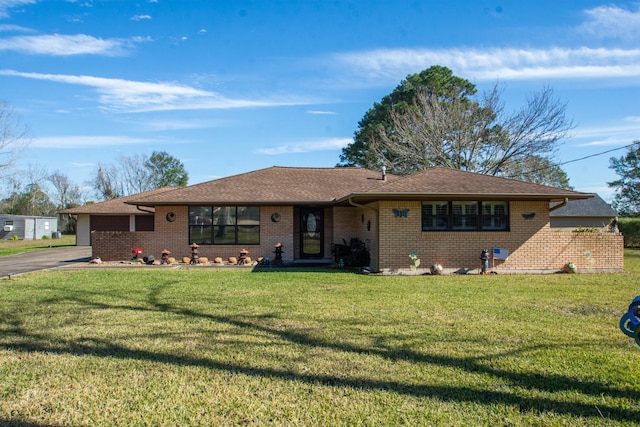 ranch-style home featuring a front yard