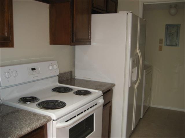 kitchen featuring electric panel, electric stove, and dark brown cabinets