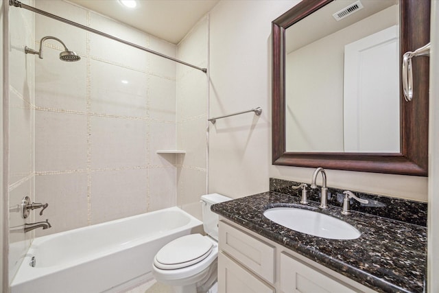 full bathroom with toilet, tiled shower / bath, and vanity