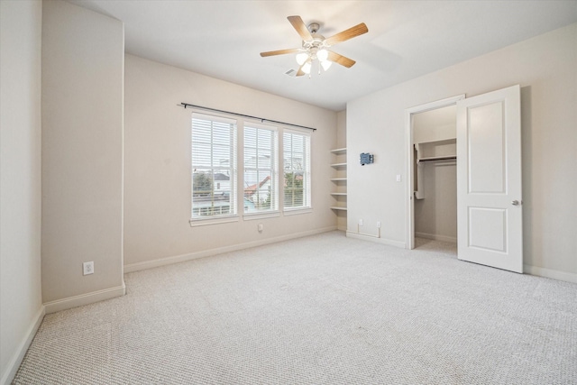 unfurnished bedroom featuring ceiling fan and light carpet