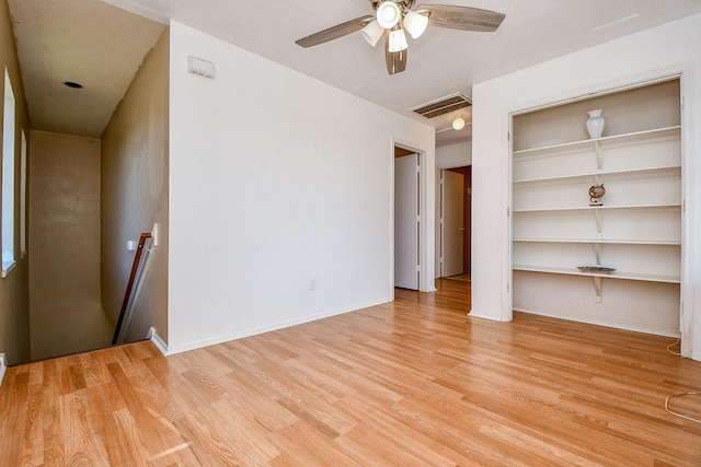 interior space with ceiling fan, light hardwood / wood-style flooring, and a closet