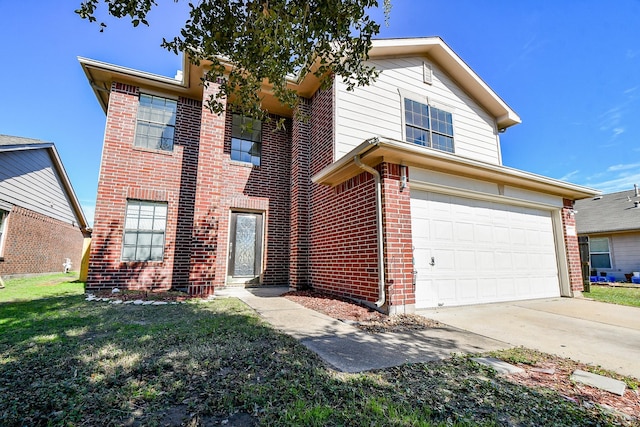 view of property featuring a front lawn and a garage