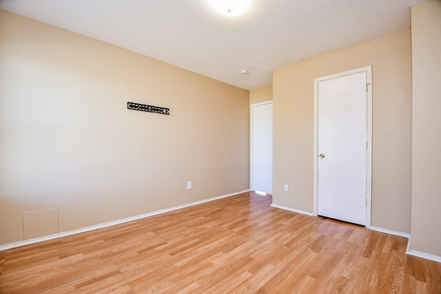 spare room featuring light hardwood / wood-style floors