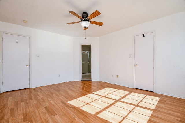 unfurnished room with ceiling fan and light hardwood / wood-style flooring