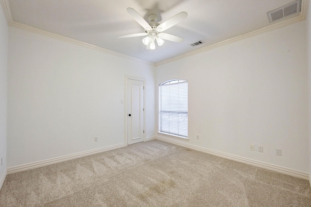 unfurnished room featuring ornamental molding, ceiling fan, and light colored carpet