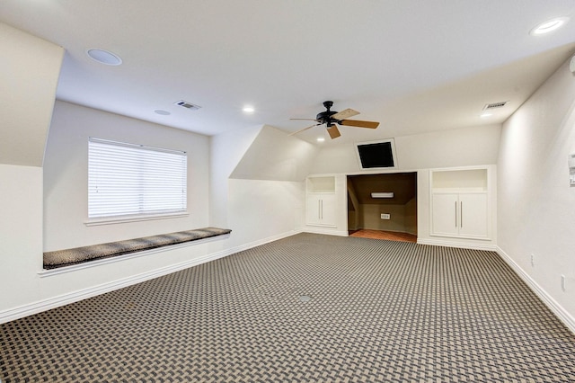 additional living space with ceiling fan, vaulted ceiling, and carpet floors