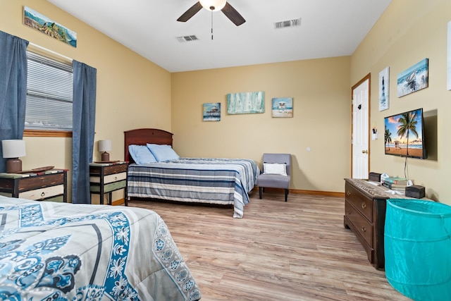 bedroom with ceiling fan and light hardwood / wood-style flooring