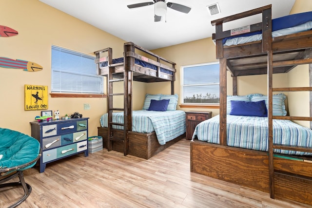 bedroom with ceiling fan and light hardwood / wood-style flooring