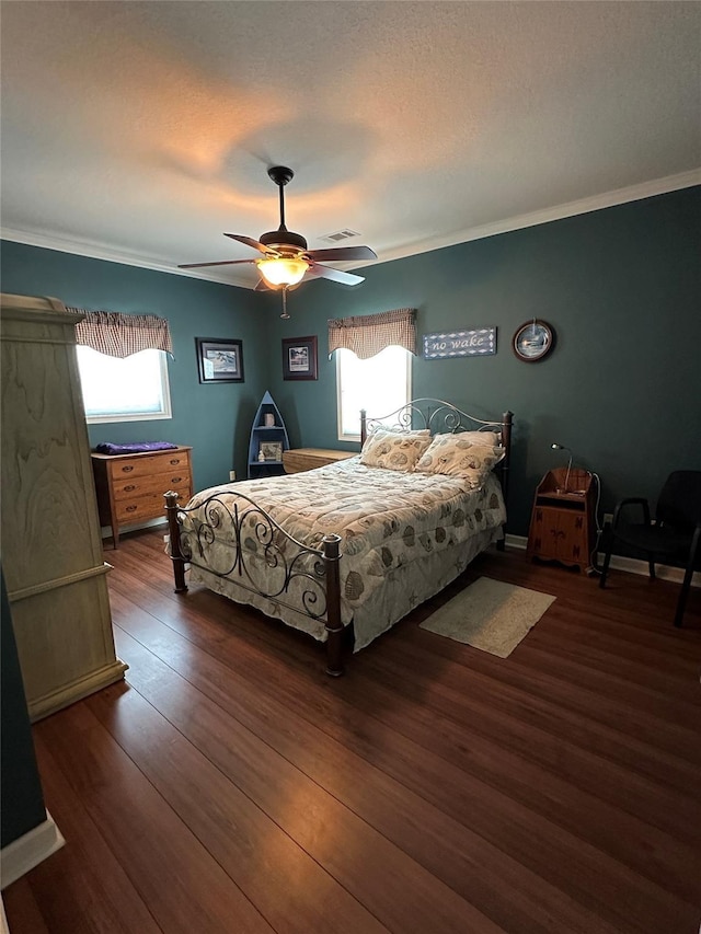 bedroom with dark wood-type flooring, ceiling fan, ornamental molding, and multiple windows